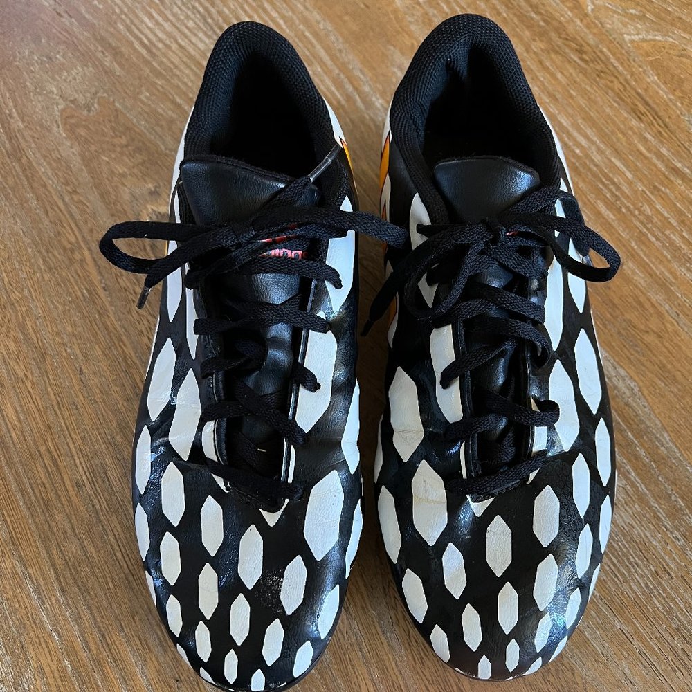 Adidas Black, white, orange soccer cleat